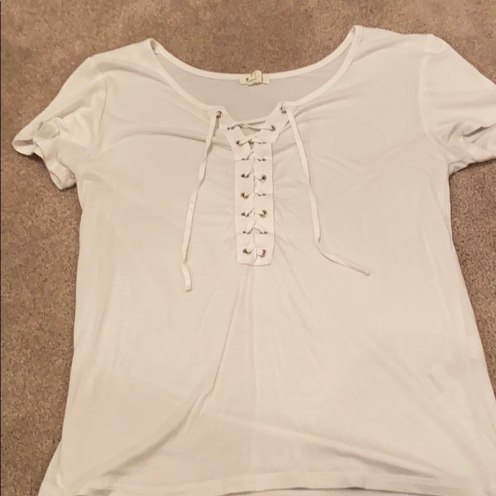 White t-shirt with ties on the front